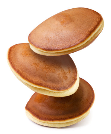 Pancakes flying close up on a white background. isolatedの写真素材