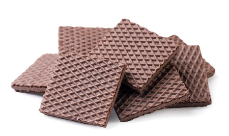 A pile of chocolate wafers close-up on a white background. isolatedの写真素材