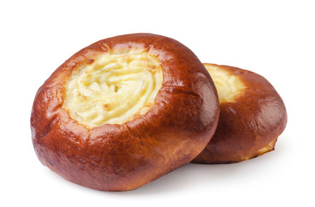 Two cheesecakes buns with cottage cheese close-up on a white background. Isolatedの写真素材