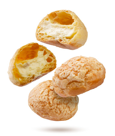 Cake eclairs and halves close-up on a white background. Isolated