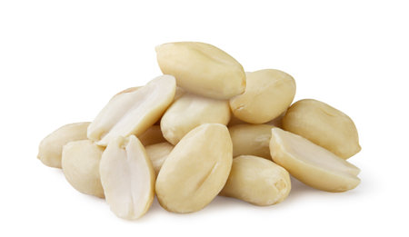 A pile of peanuts close-up on a white background. Isolated