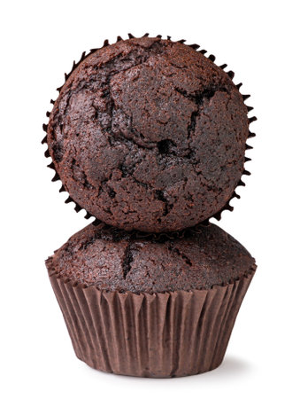 Chocolate muffins stand on each other close-up on a white background. Isolatedの写真素材