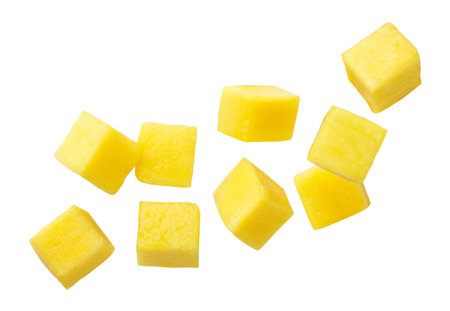 Mango cubes flying close-up on a white background. Isolatedの写真素材
