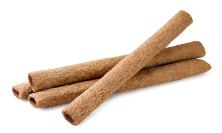 Chocolate wafer rolls close up on a white background. Isolated