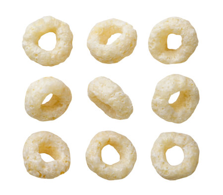 Set of cereal corn rings cut out on a white background.