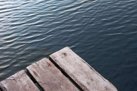 aged wooden bridge on the river for fishing, quiet water, restの写真素材