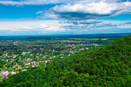 top view of the mountains and the village at the foot of the mountain, beautiful summer landscape