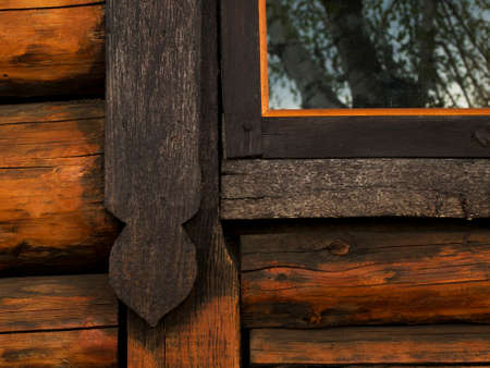 Part of the window of a wooden old houseの写真素材