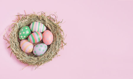 nest with Easter eggs on pink background, Easter, holiday, postcardの写真素材