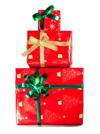 a set of gifts of red color with green and gold bows stacked, isolate