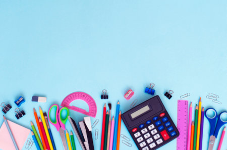 school supplies lie on a blue background, a place for textの写真素材