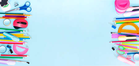 school stationery lies on both sides forming a frame with space for textの写真素材