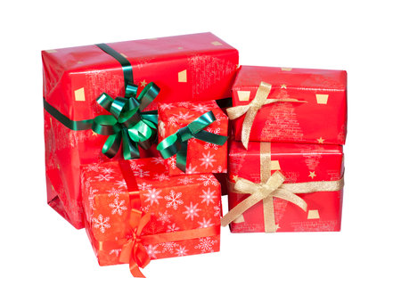 set of gifts in red paper with green and gold bowsの写真素材