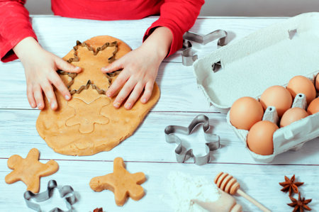baby bakes gingerbread for Christmas, homemade cakesの写真素材
