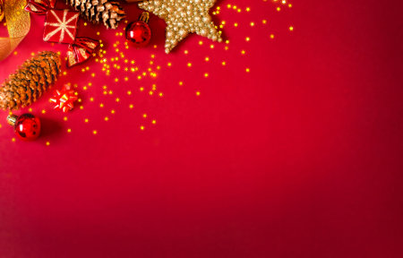 Christmas card on a red background, gold and red decorations. Copy Space