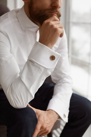 Cropped portrait of an elegant handsome guy, young bearded business businessman, or a stylish groom...