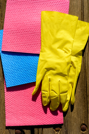 Set for spring cleaning. Jews associate spring cleaning with cleaning for Passover, Pesach in Hebrew. Jews in these days get rid of chametz-leavened products. Three microfiber ans gloves flat lay.の写真素材