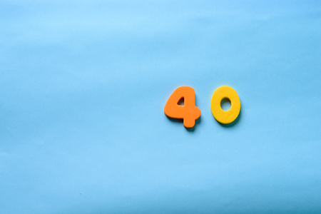 40 years old celebrating classic logo. Colored happy anniversary 40 th template yellow orange numbers. Greetings celebrates card. Traditional framed digits of ages.の写真素材