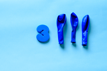 33 celebrating blue number 3 with  three balloons. Thirty three Modern alphabet digits on blue background. 33th birthday party anniversary card.の写真素材