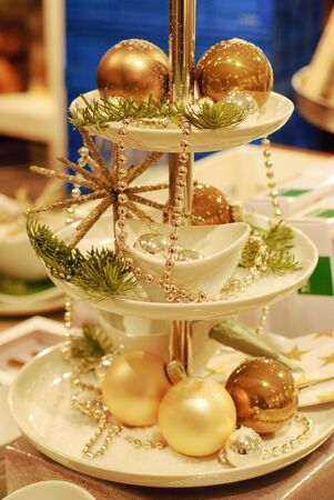 Decoration for Christmas and New Year Holiday party. Traditional crockery on Festive table setting...