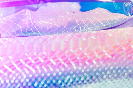 Abstract blurred snakeskin background. Neon silver snake skin pattern texture backgroundの写真素材