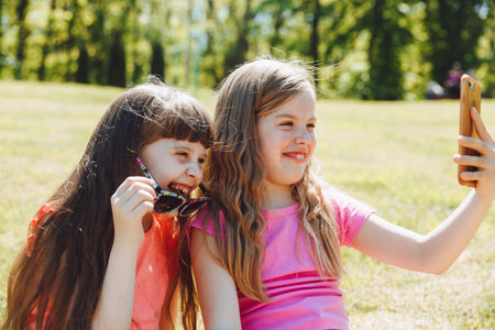 keep a blog. Little girls take a selfie for a blog. video call. Online social networks.