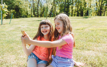 keep a blog. Little girls take a selfie for a blog. video call. Online social networks.の写真素材