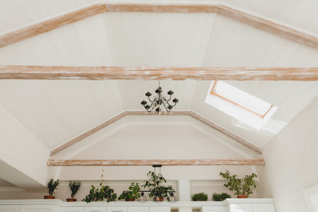 skylight in the living room. white bright living room with a window in the ceiling.の写真素材