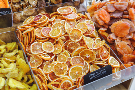 market with various dried fruits, dried apples, oranges, mangoes, papaya. shallow depth of fieldの写真素材
