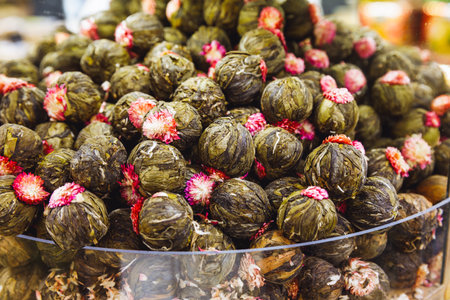 blooming tea flower. knitted flower round tea at the marketの写真素材