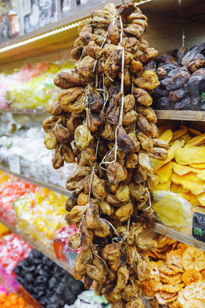 Strings of dried figs in a dry fruit store.の写真素材