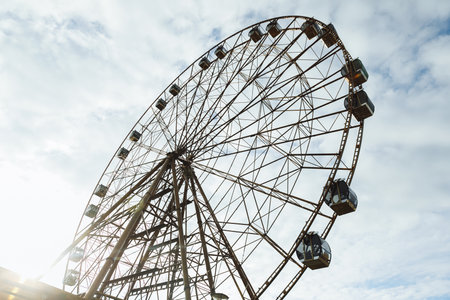 Overview of the amusement wheel in the summer evening. Ferris wheel in Sochi parkの写真素材