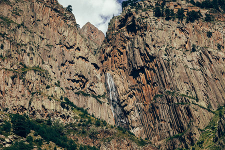 Abau-Su waterfall flowing from a high cliff in the Caucasus. Kabardino-Balkaria, Russiaの写真素材