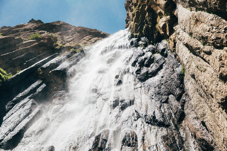 Abau-Su waterfall flowing from a high cliff in the Caucasus. Kabardino-Balkaria, Russiaの写真素材