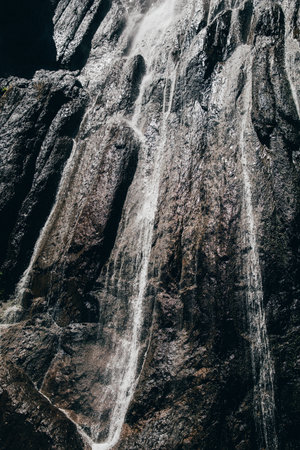 Abau-Su waterfall flowing from a high cliff in the Caucasus. Kabardino-Balkaria, Russia