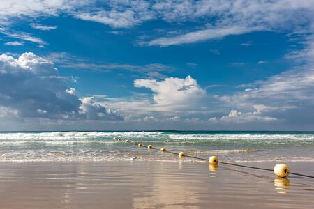 Mediterranean beach with yellow buoys in Tel Aviv,  Israel.の写真素材
