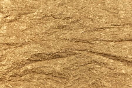 Golden paper texture or background. Craft golden paper.の写真素材
