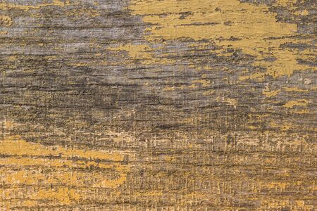 Rustic wood texture or background with yellow paint.  Close-up.の写真素材
