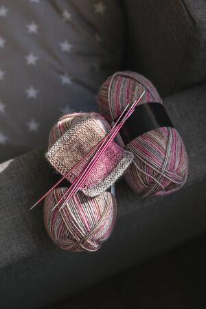 Skeins of woolen yarn and needles for hand knitting socks.  Natural colors. Concept for handmade.の写真素材