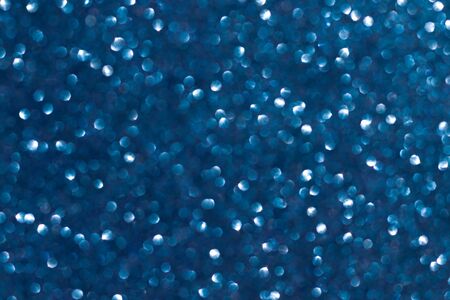 Abstract blue background. Shiny glitter bokeh in blue colors. Classic blue. Color of the year.の写真素材