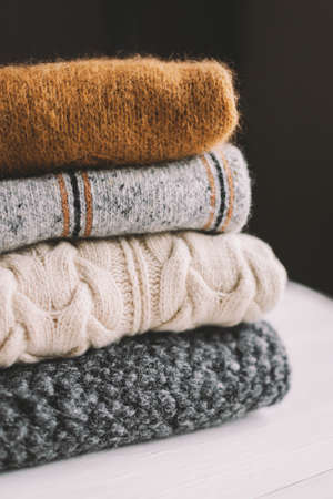 Cozy hand knitted knitwear on a dark background. Selective focus.の写真素材