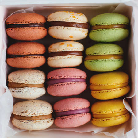 Set of multi-colored tasty french macarons in a box. Close-up.