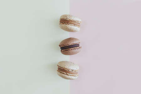 Tasty French macarons on a pastel background. Flat lay. Place for text.の写真素材