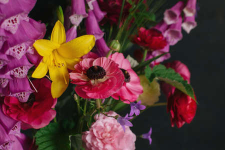 Beautiful summer flowers on a dark background. Selective focus.