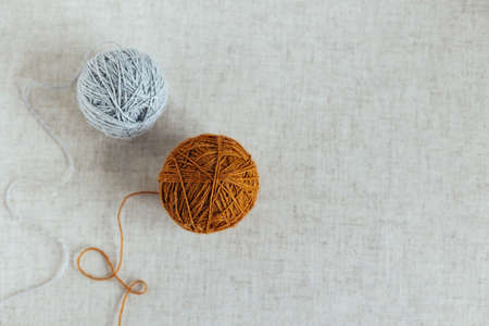Cozy balls of yarn for knitting. Background for handmade and slow homelife. Place for text.