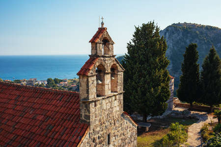 Amazing view of the old monastery, sea and Petrovac city from the hill, Montenegro. Beautiful sunny day.の写真素材
