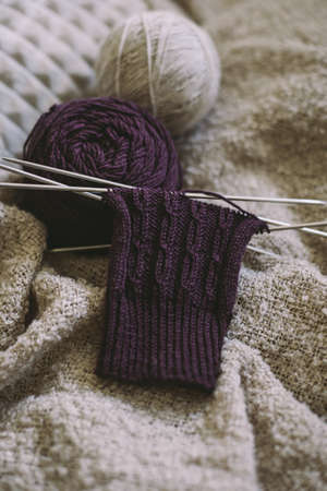 Hand knitting sock with needles and yarn balls. Concept for handmade and hygge slow life.の写真素材
