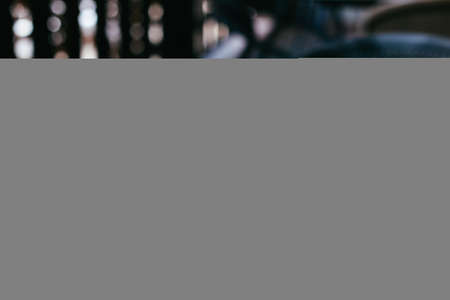 Cup of black coffee on a rustic wooden table in a street cafe. Place for text.の写真素材