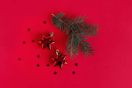 Christmas background with spruce branches and red ornaments. Flat lay. Place for text.の写真素材