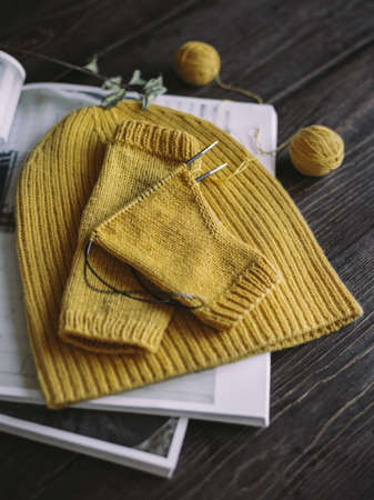 Hand knitting with needles and yarn balls. Concept for handmade and hygge slow life.